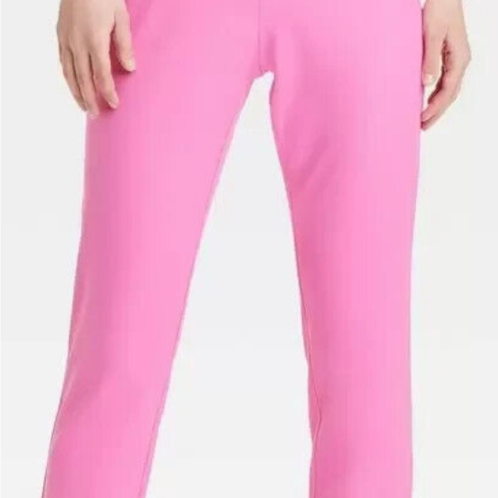 Pink, straight leg cut, mid rise waist.  Faux pockets. Side zipper.